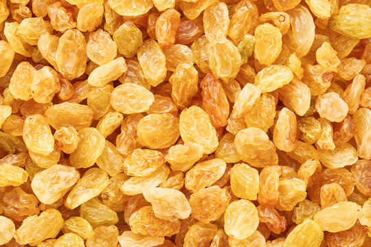 Golden raisins as background. Top view, food background
