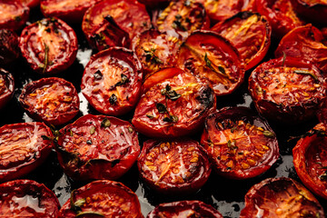 a lot of cut tomatoes for drying