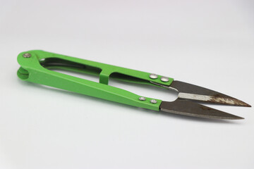 Thread clipper or yarn cutter or steel sewing scissors isolated on white background