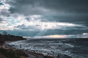 dark clouds on a windy beach shore coast