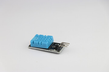 DHT11 temperature and humidity sensor module isolated on white background with side view