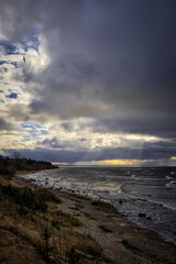 dark clouds on a windy beach shore coast