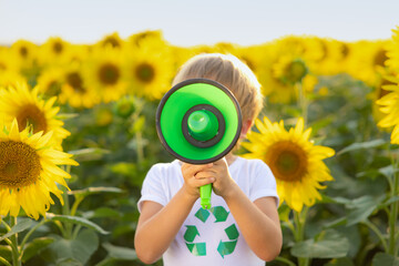 Child in spring sunflower field