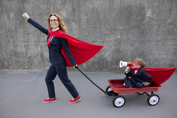 Happy woman and child going to work outdoor