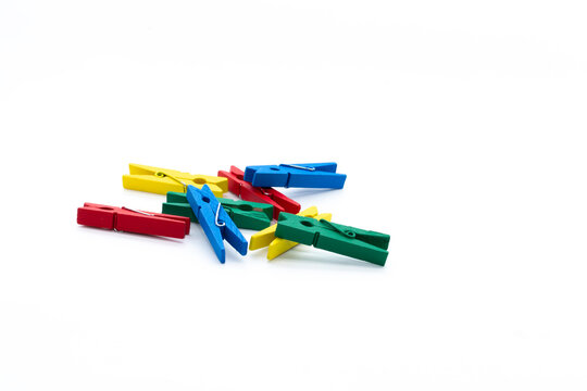 colored pegs on a white background