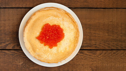 A stack of pancakes in a white plate