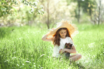 Cute little girl outdoor. Child on natural background. Kid in the grass