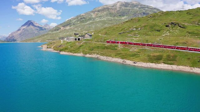 Aerial 4K, Switzerland, Bernina Pass, view of the train and the Bianco lake