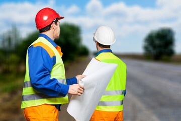 Teamwork of surveyor engineers worker making measuring on road works. survey engineer