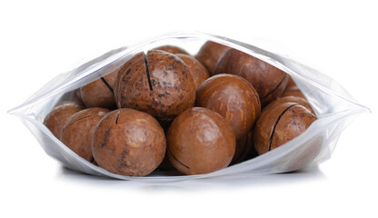 Macadamia nuts in pack on white background isolation