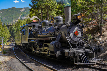 Georgetown, Colorado - 9-19-2021:  a vintage steam locomotive on the Georgetown Loop Railroad in Georgetown Colorado - obrazy, fototapety, plakaty