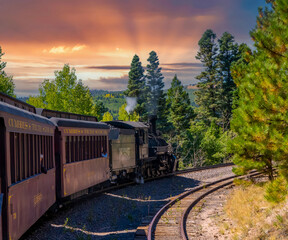 A steam engine locomotive and passenger cars on the Cumbris & Toltec scenic railroad in colorado