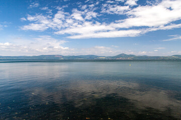 Landscape of Lake of Bracciano, Lazio, Italy, in  a cloudy summer day