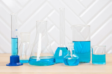 Laboratory glassware with test tubes. flasks, dropper, petri dishes, measuring cups and cylinders for scientific laboratories, laboratory equipment and analysis