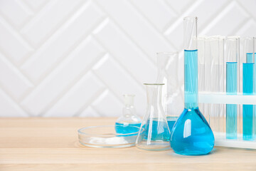 Laboratory glassware with test tubes. flasks, dropper, petri dishes, measuring cups and cylinders for scientific laboratories, laboratory equipment and analysis