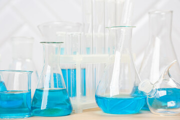 Laboratory glassware with test tubes. flasks, dropper, petri dishes, measuring cups and cylinders for scientific laboratories,