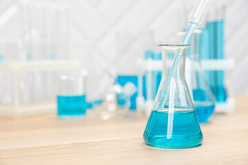 Laboratory glassware with test tubes. flasks, dropper, petri dishes, measuring cups and cylinders for scientific laboratories,