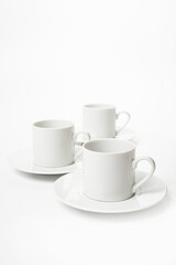 White porcelain cup and saucer for cappuccino and coffee isolated on a white background