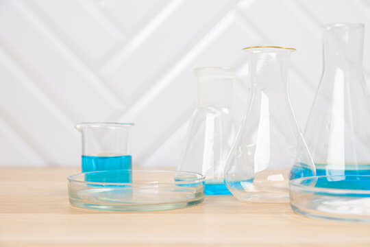 Laboratory glassware with test tubes. flasks, dropper, petri dishes, measuring cups and cylinders for scientific laboratories, laboratory equipment and analysis