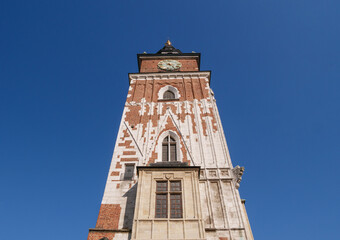 Fototapeta na wymiar Historic Krakow Town Hall Tower, Wieża Ratuszowa w Krakowie. Main Market Square in the Old Town district of Kraków, Poland.