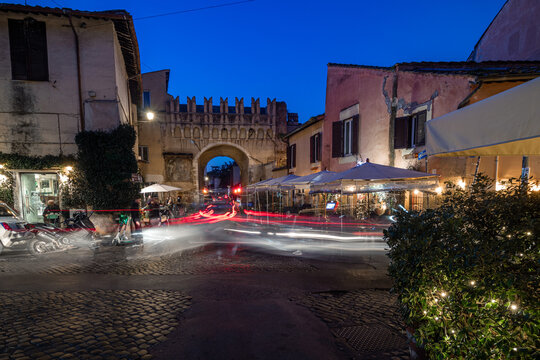 Trastevere Rome Italy at night. View of an Italian Vespa motorcycle on the street corner
