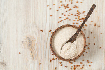 buckwheat flour on white wooden surface