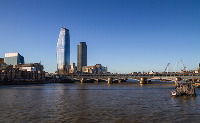 Naklejka premium One Blackfriars (The Vase or The Boomerang) skyscraper and Blackfriars Railway Bridge, crossing the River Thames on January 16, 2019 in London, England, United Kingdom.