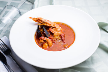 seafood soup, fresh seafood soup on a white plate