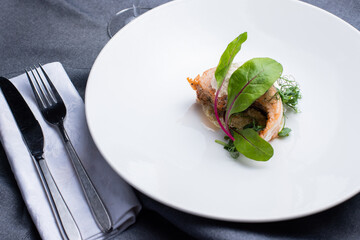 fish fillet on a white plate, pike fillet on a white plate