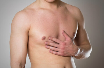 Obraz premium Chest pain. The man's chest hurts