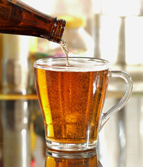 pouring beer into glass