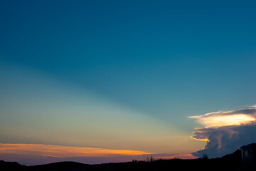 Beautiful sunset in Long Hai beach, Ba Ria Vung Tau Viet Nam, sea coast with mountains and blue sky, and sunlight