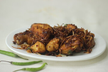 Chicken prepared in Kerala style with onions tomatos and spices.