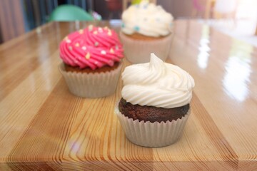 Tasty sweet donuts for Hanukkah on wooden desk