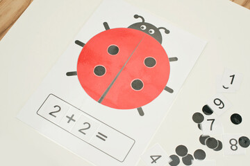 Ladybug table game. logical excersice. dots and numbers. create your own mathematical equation. implement for primary school and children with disabilities.