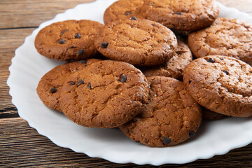 Oatmeal cookies with chocolate slices.Delicious dessert for tea.