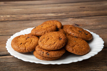 Oatmeal cookies with chocolate slices.Delicious dessert for tea.