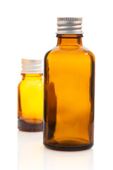 Small glass bottles isolated on white background