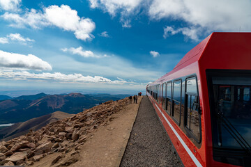 Colorado Springs - 9-19-2021: A view of a pikes peak cog railway train waiting to load passengers...