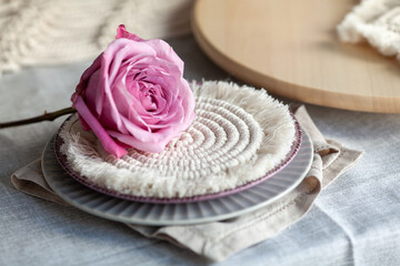 Fototapeta na wymiar Beautiful table decor. Macrame napkins, flowers