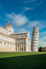 Piazza dei Miracoli - Pisa, Italy, January 2021: Cathedral medieval Roman Catholic Assumption of the Virgin Mary in Piazza dei Miracoli and Pisa leaning tower