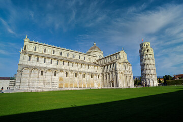 Piazza dei Miracoli - Pisa, Italy, January 2021: Cathedral medieval Roman Catholic Assumption of the Virgin Mary in Piazza dei Miracoli and Pisa leaning tower
