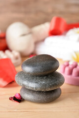Fototapeta na wymiar Beautiful spa stones for Valentine's Day celebration on table, closeup