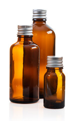 Set of small glass bottles isolated on white background