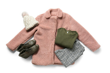 Stylish winter clothes and shoes on white background