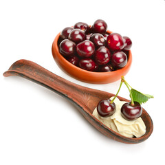 Appetizing sweet cherries and fruit mousse isolated on white background.