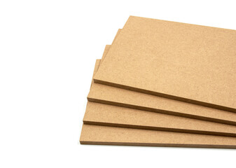 Boards of raw mdf brown color, photographed on the right side of the white background.
