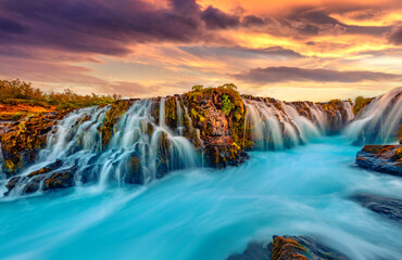 Wonderful summer view of Bruarfoss Waterfall, secluded spot with cascading blue waters. Great...