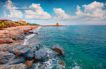 Fototapeta premium Exciting marine scenery. Wonderful summer view of Torre di Bari tower. Splendid morning scene of Sardinia island, Italy, Europe. Beautiful seascape of Mediterranean sea.