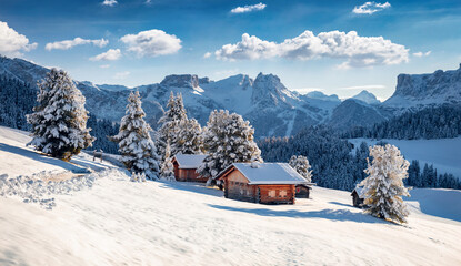 Frosty morning view of Alpe di Siusi village. Breathtaking winter landscape of Dolomite Alps. Majestic outdoor scene of ski resort, Ityaly, Europe. Beauty of nature concept background. - obrazy, fototapety, plakaty